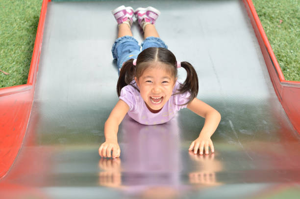 istock Girls playing in the park 858834734
