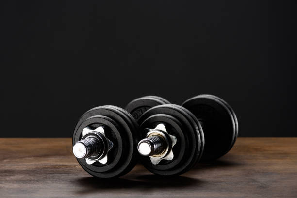 istock Closeup of two dumbells 858851514
