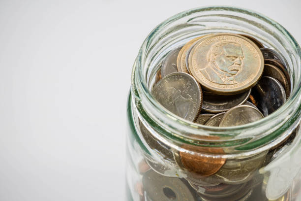 istock Coin in glass bottle jar, saving investment concept 858865072