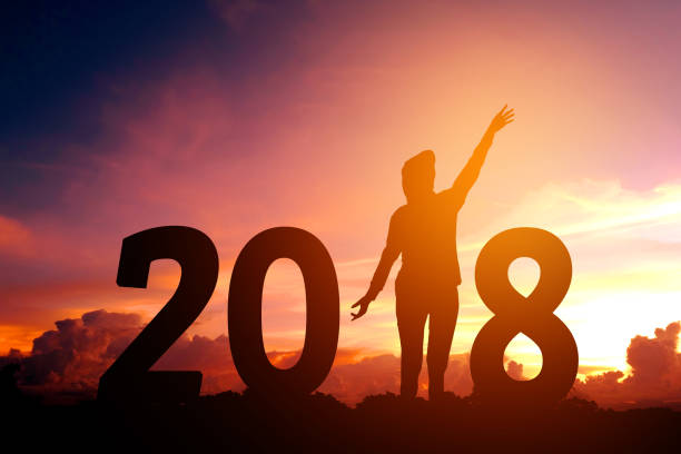 istock Silhouette young man Happy for 2018 new year 858867660