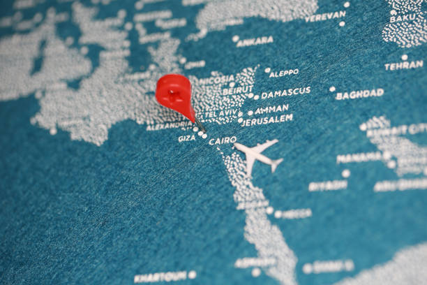 istock airplane fly on the blue painted map 858884696