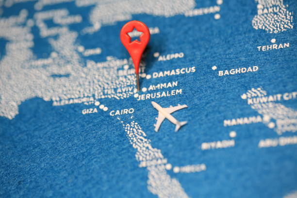 istock airplane fly on the blue painted map 858885640