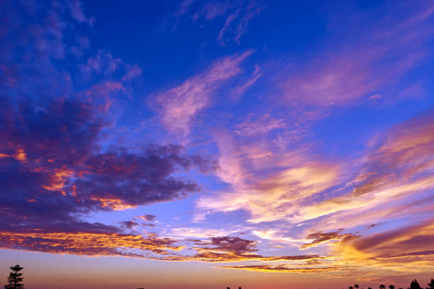 tropical evening sky aglow from the setting sun stock photo