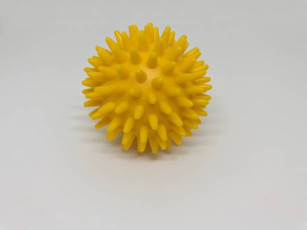 istock Yellow massage ball 858899428