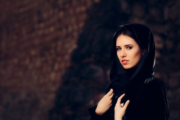 istock Beautiful Dark Princess in Black Hooded Cape 858906738