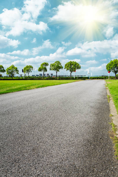 istock Asphalt road and green woods under the blue sky 858910080