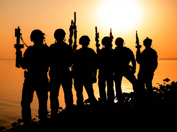 istock Army soldier silhouettes 858923826