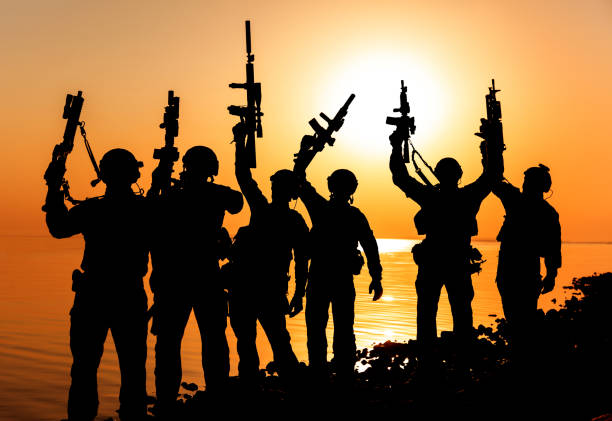 istock Army soldier silhouettes 858923854