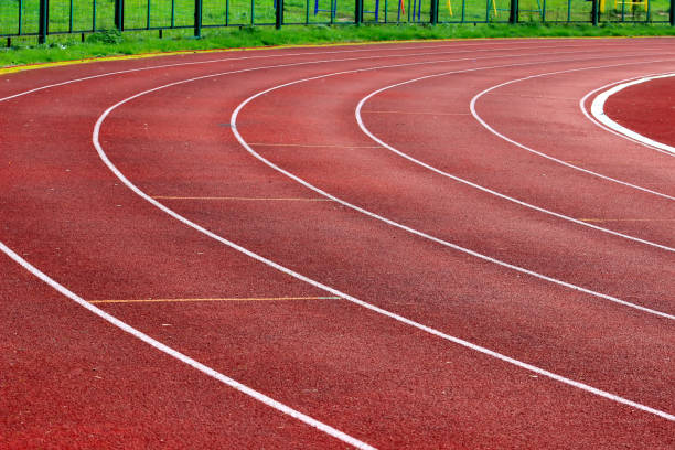istock Track running, Red treadmill in sport field. 858946258