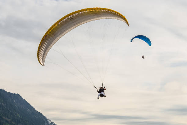 Senior man with gray long beard paragliding in Julian Alps, Primorska Region in Slovenia, Europe,Nikon D850