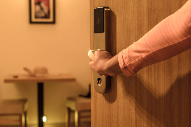 Hotel door Female hand opening hotel room, selective focus doorknob photos stock pictures, royalty-free photos & images