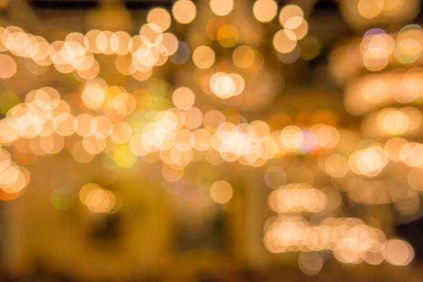 istock Gold bokeh lights and gold shiny sparkles background. 858951842