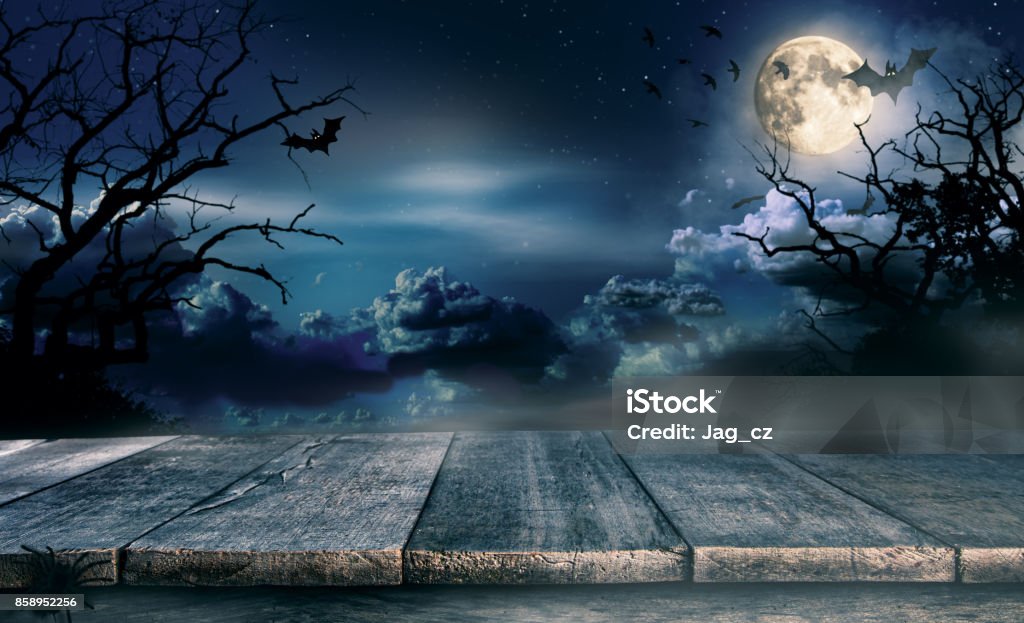 Spooky halloween background with empty wooden planks Spooky halloween background with empty wooden planks, dark horror background. Celebration theme, copyspace for text. Ideal for product placement Halloween Stock Photo