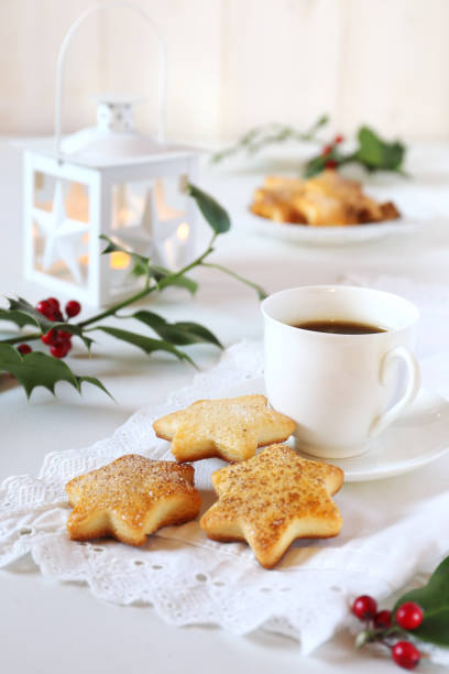 istock Christmas cookies, coffee, holly and white lantern 858952656