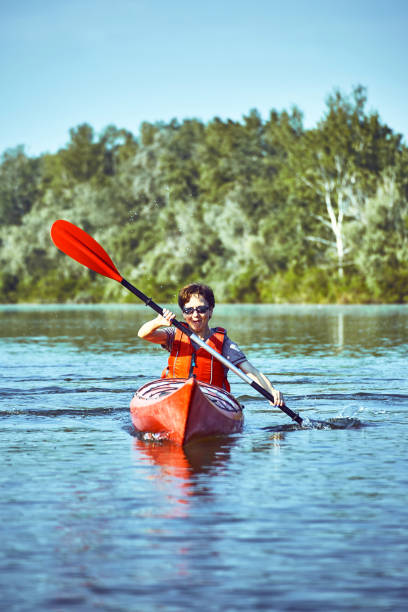 istock A canoe trip along the river along the forest in summer. 858959536