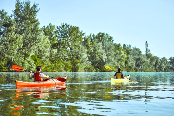 istock A canoe trip along the river along the forest in summer. 858959544