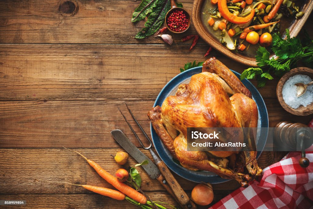 Christmas or Thanksgiving turkey Christmas or Thanksgiving turkey on rustic wooden table Thanksgiving - Holiday Stock Photo