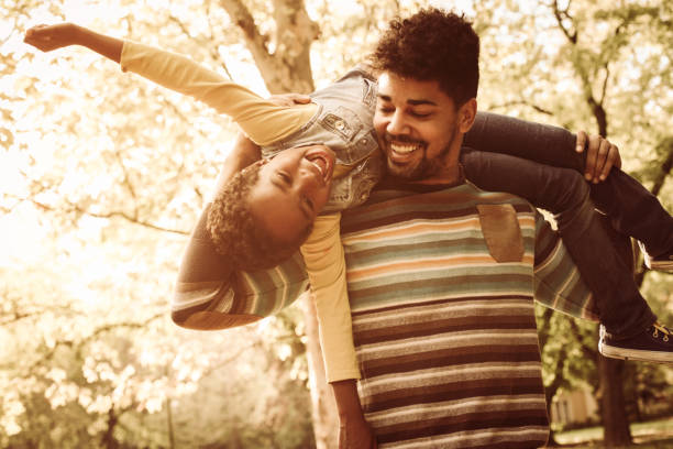 istock African American father with daughter on meadow. 858960144