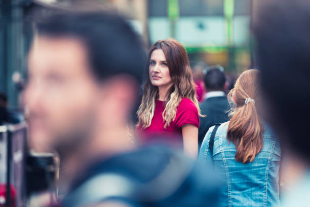 istock Girl among the crowd 858963120
