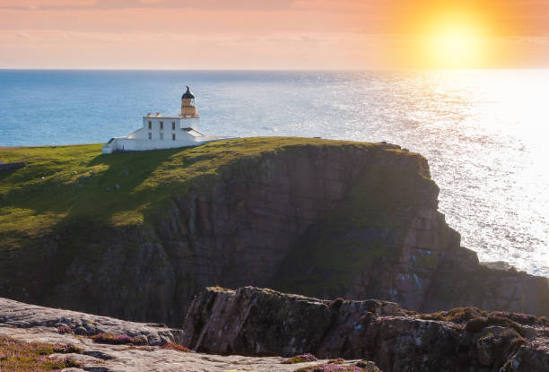 istock Lighthouse on a coast of Scottish highlands 858966204