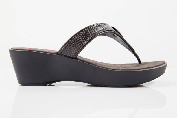 istock Female Black Leather Slipper on White Background 858966478