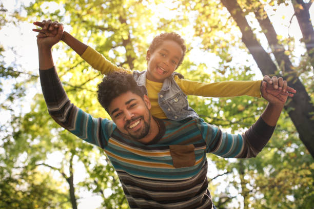 istock African American father with daughter on meadow. 858971986