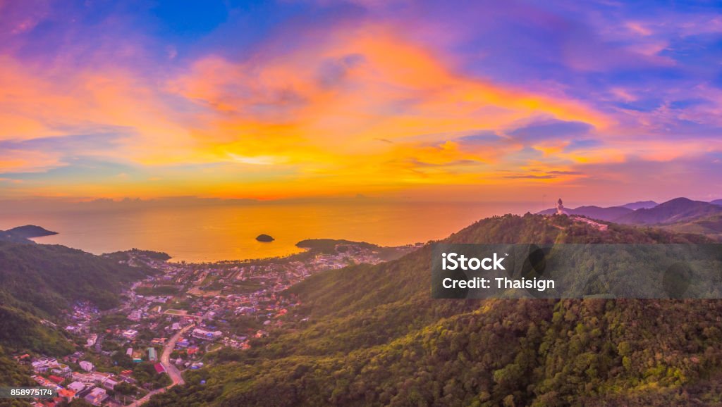 sunset above the way to Kata Karon beach. aerial photography the waygo to Kata Noi beach Kata beach and Karon beach in sunset on the way can see big Buddha on right side big Buddha is on the top of Nagkerd mountain. Aerial View Stock Photo