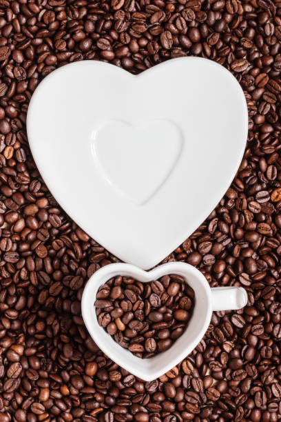 istock cup and saucer on coffee beans background 858977882