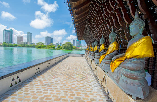 Statues Of Seema Malakaya At The Gangarama Temple The Statues Of Seema Malakaya At The Gangarama Temple In Beira Lake. Seema Malakaya Is The One Of Beautiful Religious Structures In Colombo theravada photos stock pictures, royalty-free photos & images