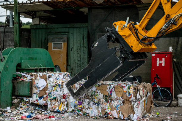 istock Separation of Cardboard at Garbage Recycling Center 858978798