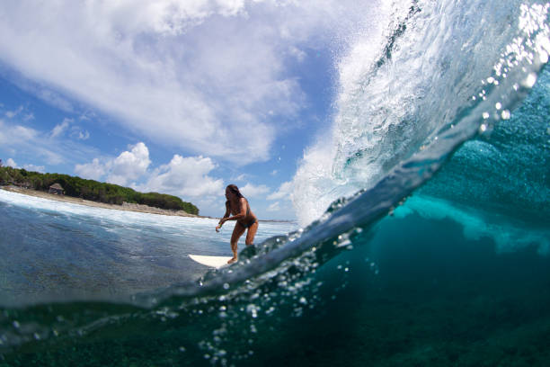 istock Two worlds surfer girl 858979564