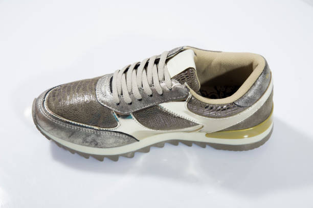 istock Female Brown Sneaker on White Background 858986150