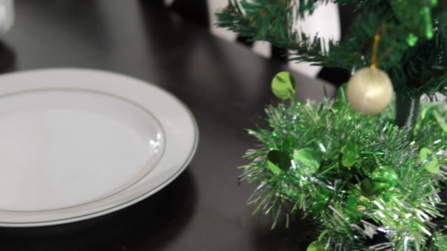 Christmas tree on table for dinner with chicken background