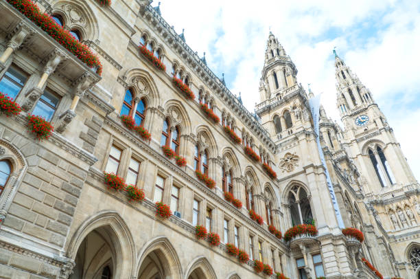 The architectures of Vienna Vienna, Austria - August 6, 2016: Upward view of the Town Hall facade in a cloudy day vienna city hall stock pictures, royalty-free photos & images