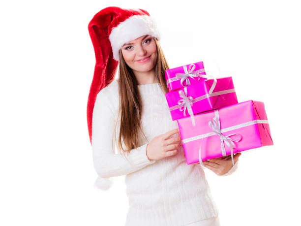 istock Woman santa helper hat with many pink gift boxes 858993674