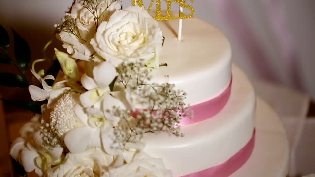 White wedding cake with flowers.