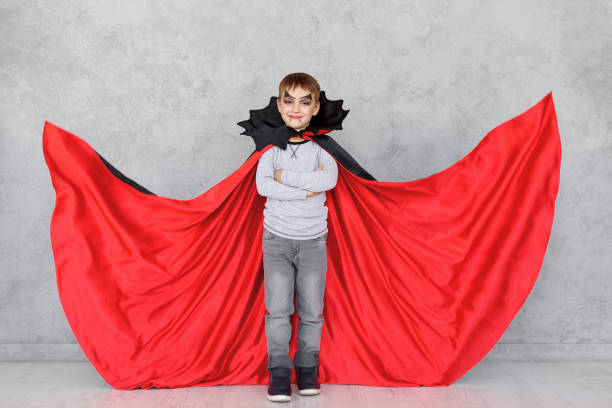 istock Boy vampire portrait with crossed hands 858995520