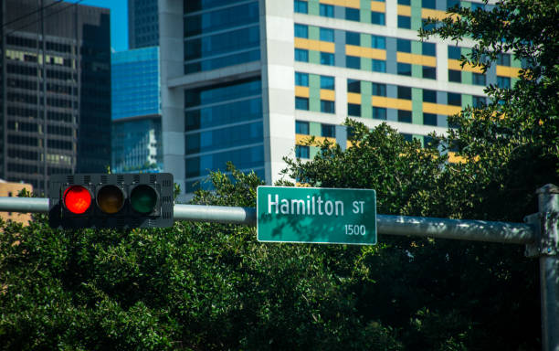 istock Hamilton street sign and red light with Houston downtown background 859005944