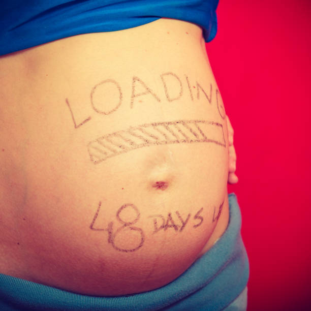 istock Pregnant woman belly with drawings 859010842