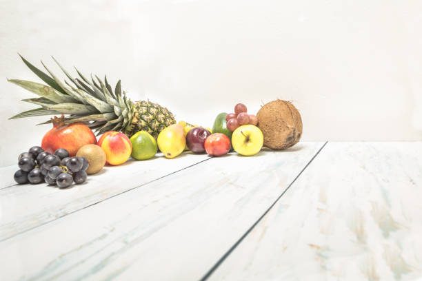 Healthy fruit background ; Studio photo of different fruits on white and  blue  vintage wooden table , high resolution product