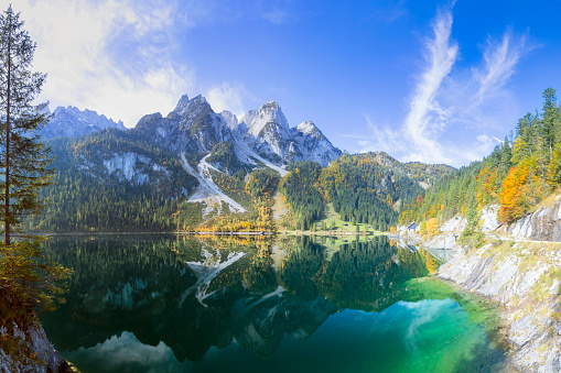 Vilshany water reservoir on the Tereblya river, Transcarpathia, Ukraine. Picturesque lake with clouds reflection. Beautiful autumn day in Carpathian Mountains.