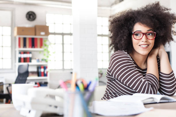 istock Smiling woman resting at workplace 859013856