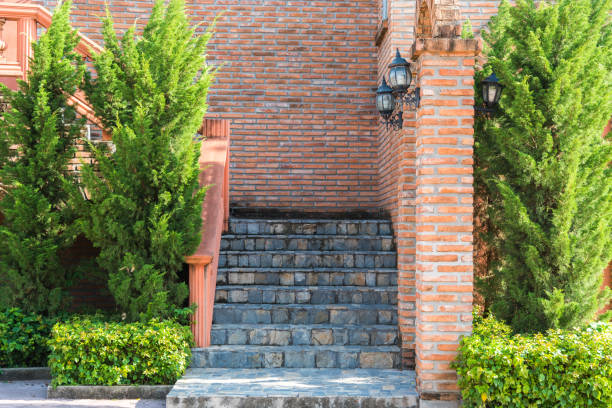 istock vintage stone stair and red brick wall 859014194