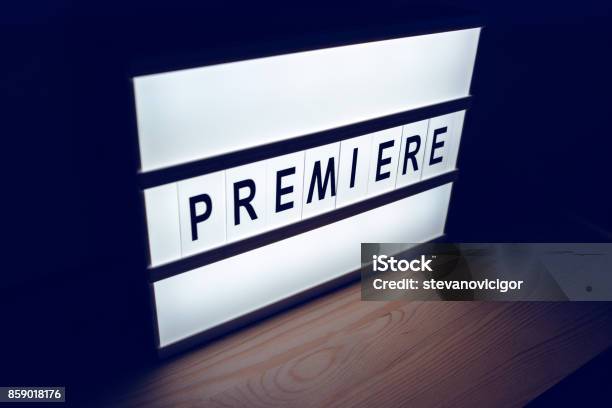 Vintage Illuminated Lightbox Premiere Sign Stock Photo - Download Image Now - Announcement Message, Arts Culture and Entertainment, Audience