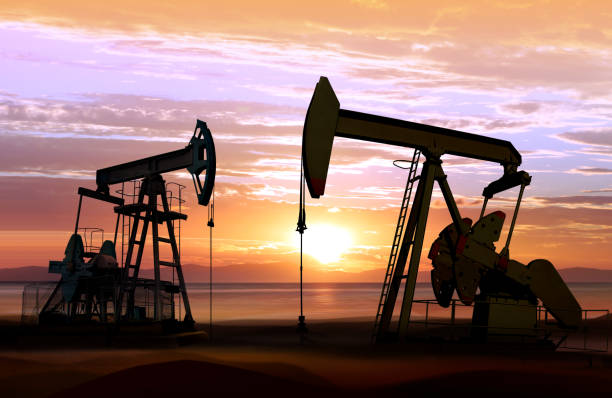 oil pumps on sunset silhouette of working oil pumps on sunset background drilling rig stock pictures, royalty-free photos & images