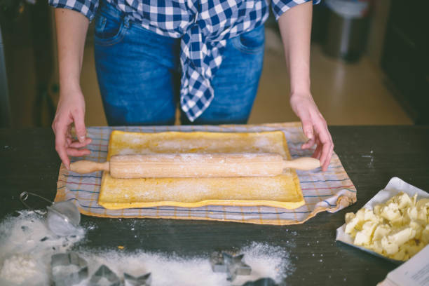 istock woman in kitchen baking cookies . 859024918