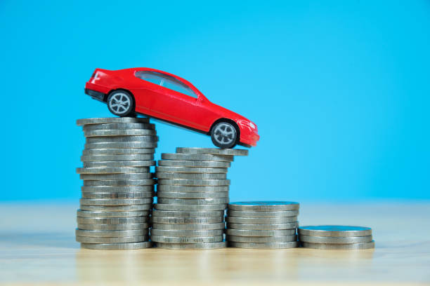 istock red miniature car model on stack of coins 859026170