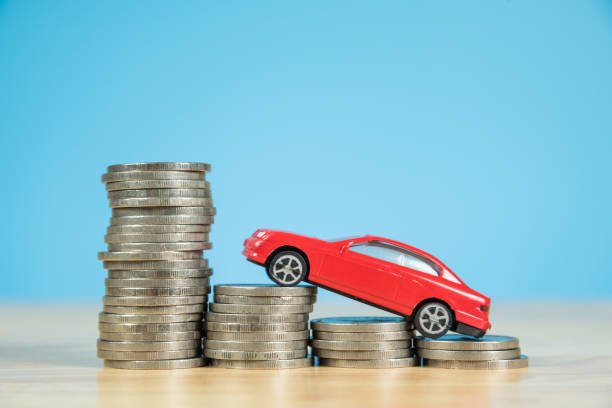 istock red miniature car model on stack of coins 859026178