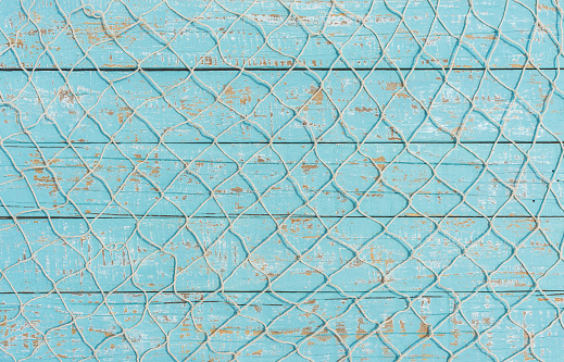 Fishing Net Texture Over Light Blue Wood Maritime Background Stock Photo -  Download Image Now - iStock