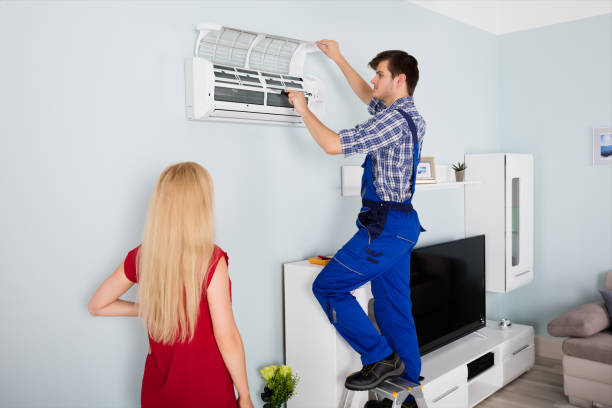 istock Technician Repairing Air Conditioner At Home 859031596
